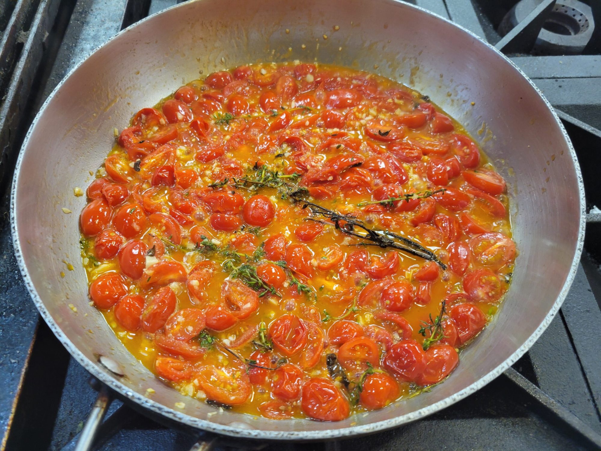 Braised Cherry Tomatoes cherry tomatoes braising in a pan