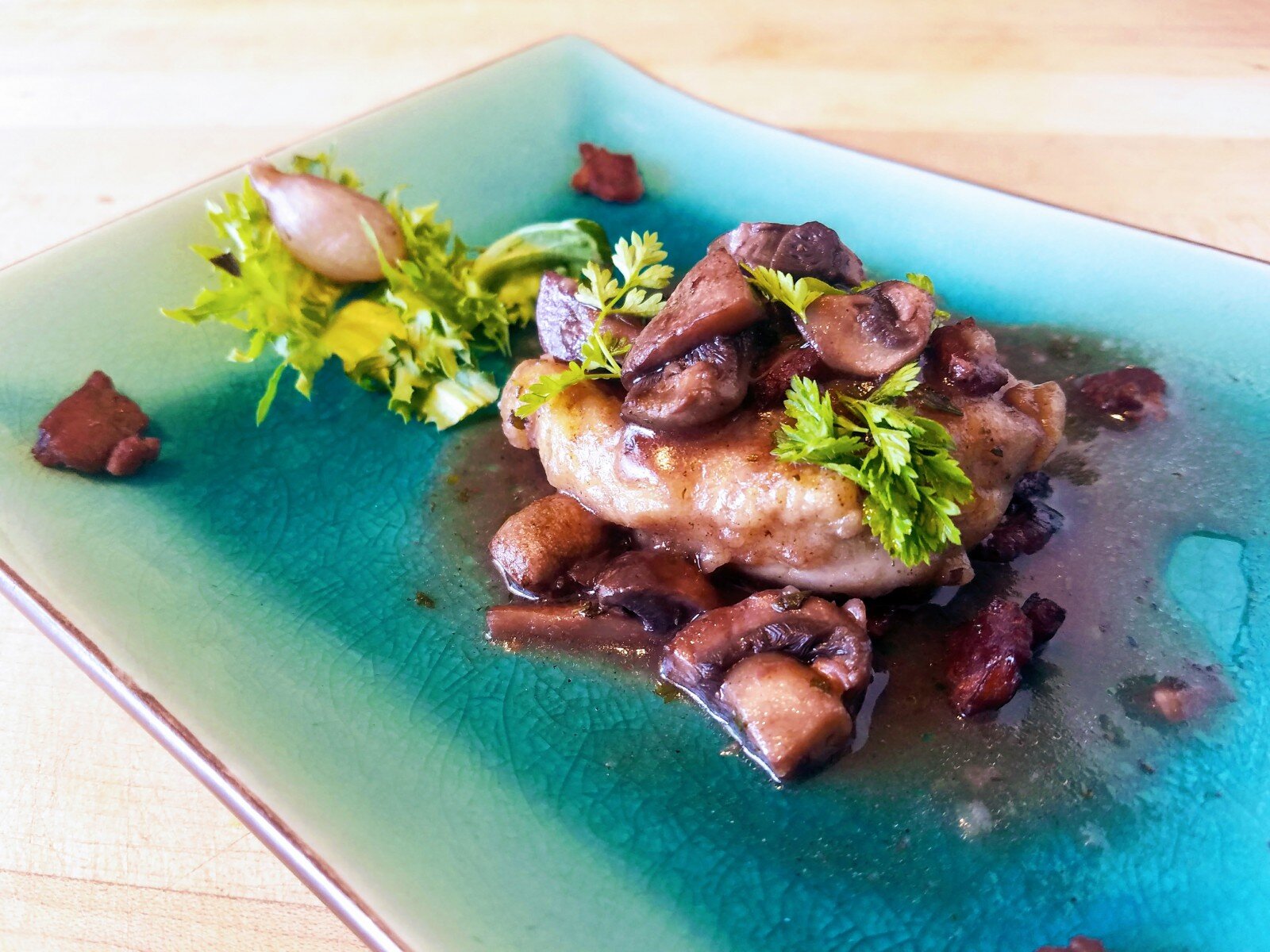 Chicken+Bistro+in+Wine+and+Cognac a plate of food on a table
