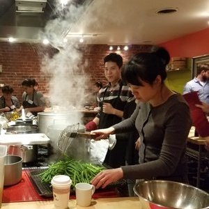 a person cooking in a kitchen preparing food