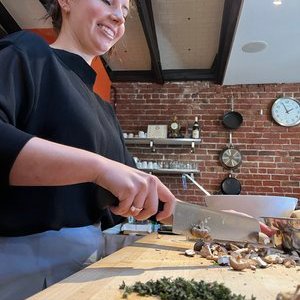 Lady preparing food in a kitchen