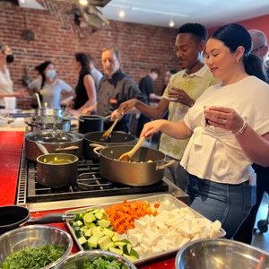 a person cooking food in a bowl