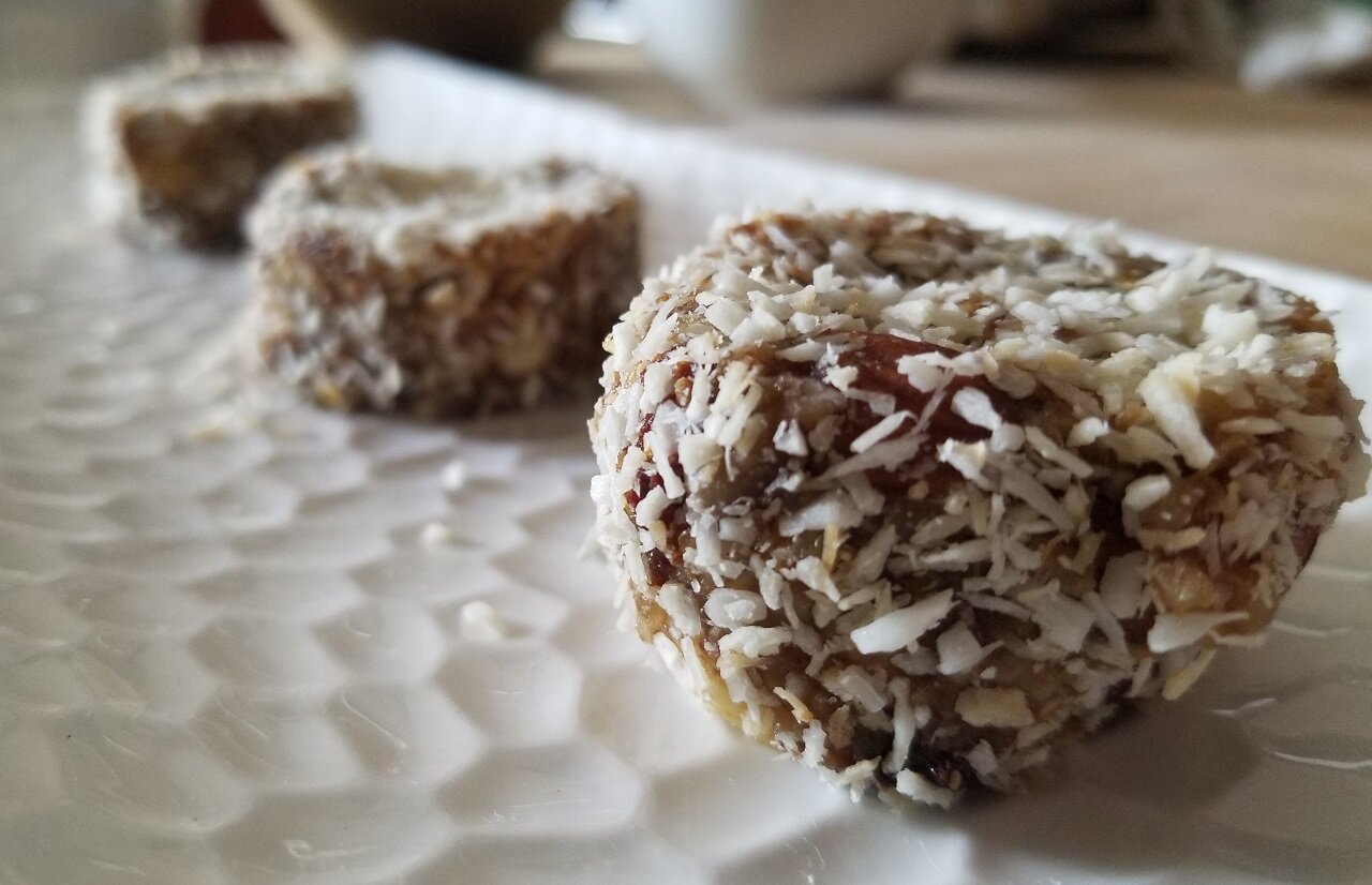 Goji+Coconut+Bliss+-+Homemade+Bar+-+Asset+mark+-+2020.09.15 a piece of chocolate cake on a plate
