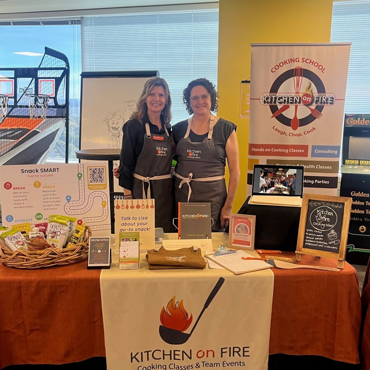 a group of people sitting at a table in front of a store